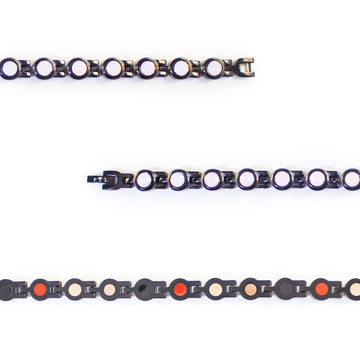 Close-up showing pink crystals and refined black interlocking links.